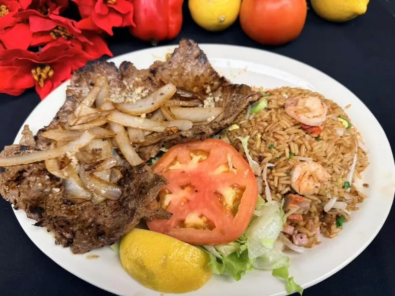 Grilled steak, shrimp fried rice and salad at La Caridad 72, a Asian Restaurant in New York