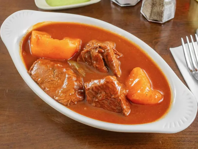 Beef stew with potatoes in red sauce at La Caridad 72, a Asian Restaurant in New York